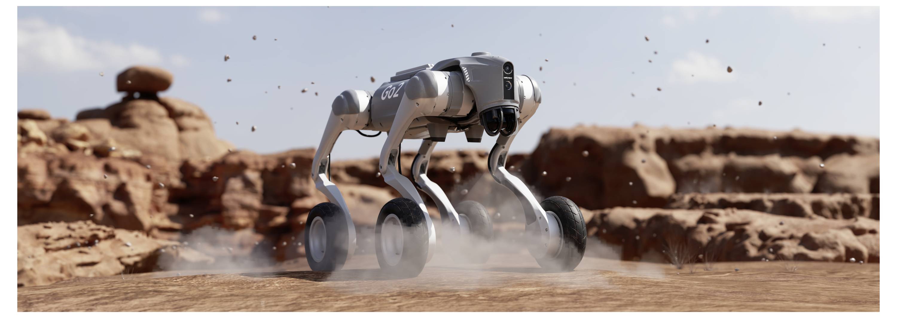 Ein vierbeiniger Roboter mit Rädern bewegt sich über eine staubige Wüstenlandschaft und wirbelt Staub in der Nähe von roten Felsformationen auf.