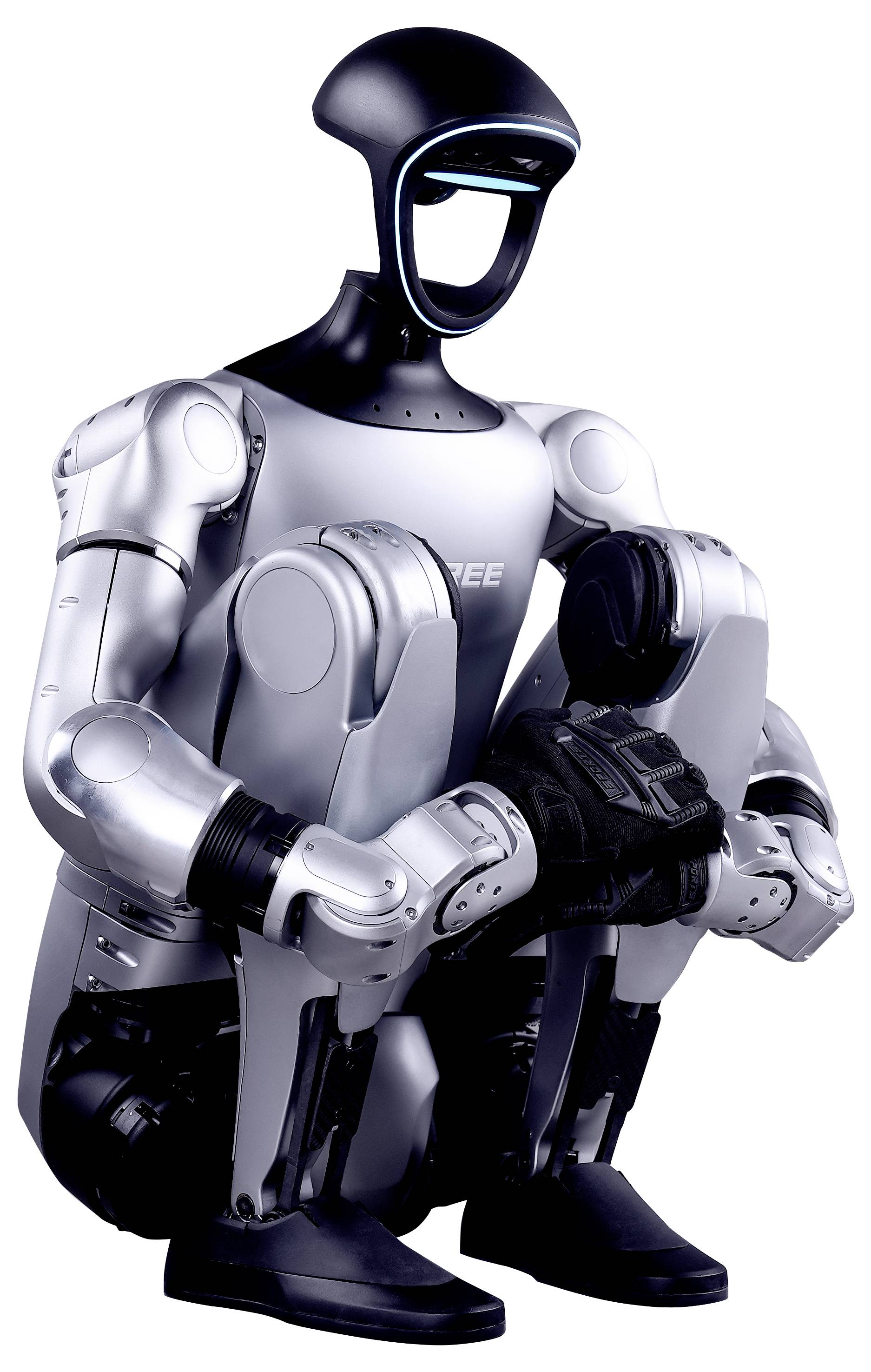 Humanoider Roboter sitzend mit hochgezogenen Knien, trägt dunkel- und silberfarbene panzerartige Platten, freigestellt auf weißem Hintergrund.