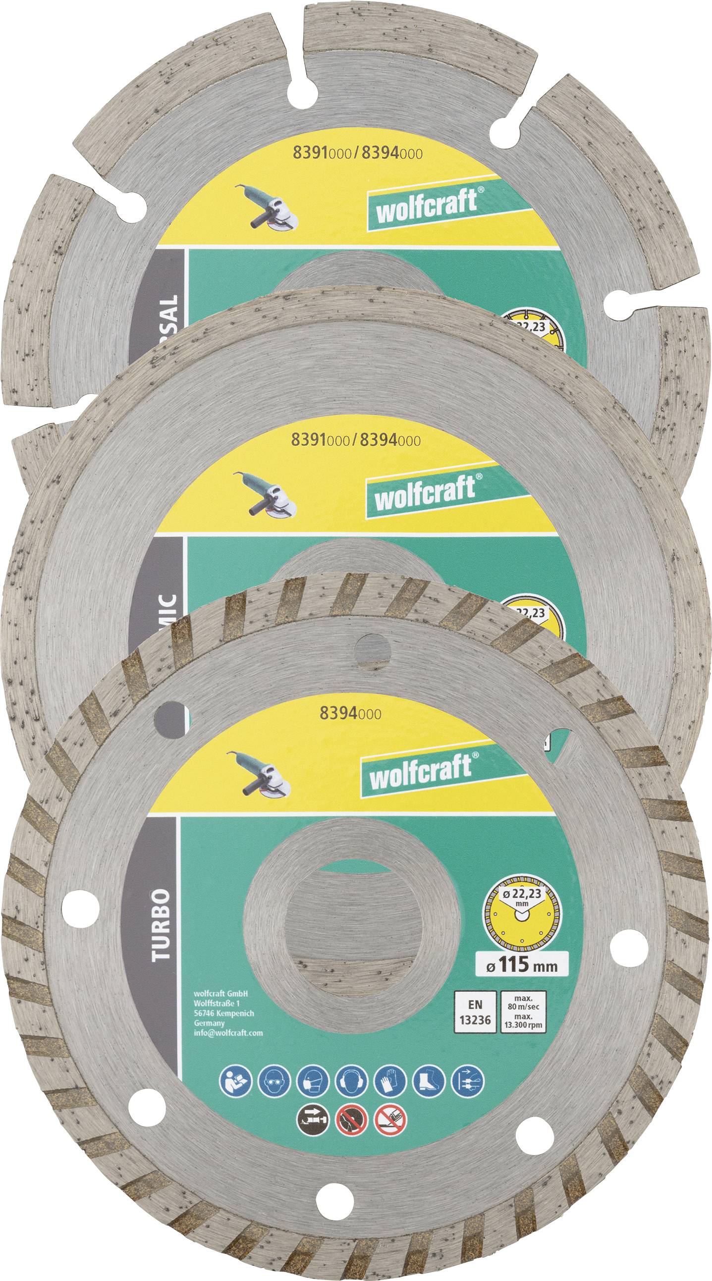 Stapel von vier Wolfcraft-Kreissägeblättern in Verpackung, zeigt verschiedene Blatttypen einschließlich Turbo und Universal, mit Durchmesserbezeichnungen und Befestigungslöchern.