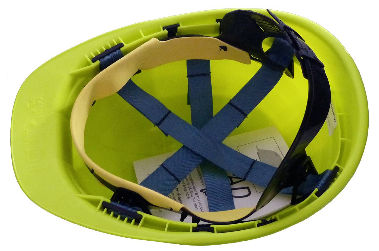 Grüner Schutzhelm mit blauen Riemen und einer dunklen Schutzbrille darin.