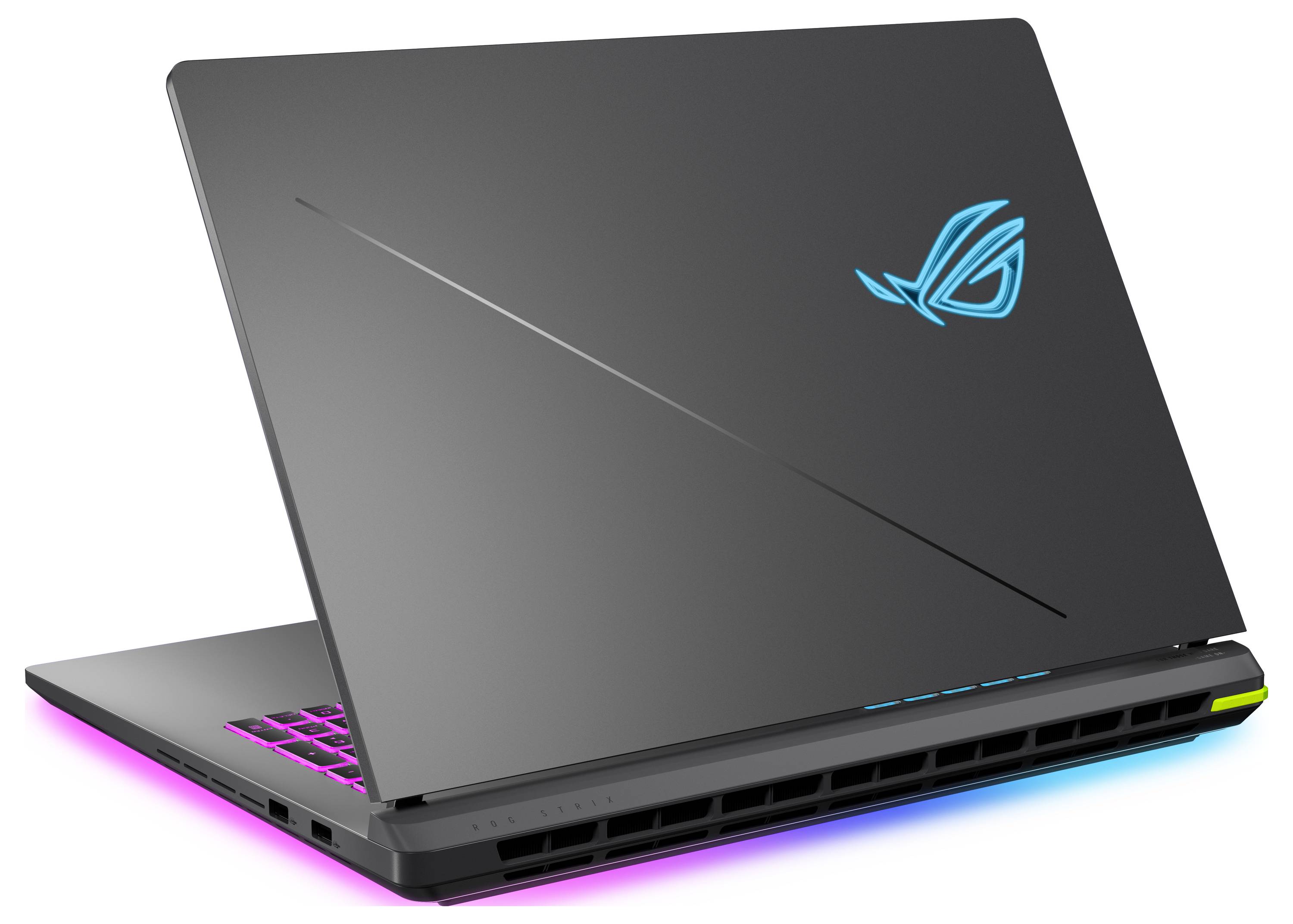 Geschlossenes schwarzes Gaming-Laptop mit beleuchtetem RGB-Tastatur und cyan-farbenem Logo, schräg auf weißem Hintergrund dargestellt.