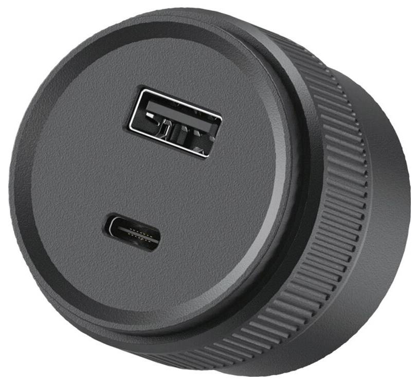 Runder schwarzer Netzadapter oder Ladegerät mit USB-A- und USB-C-Anschlüssen auf der Vorderseite.