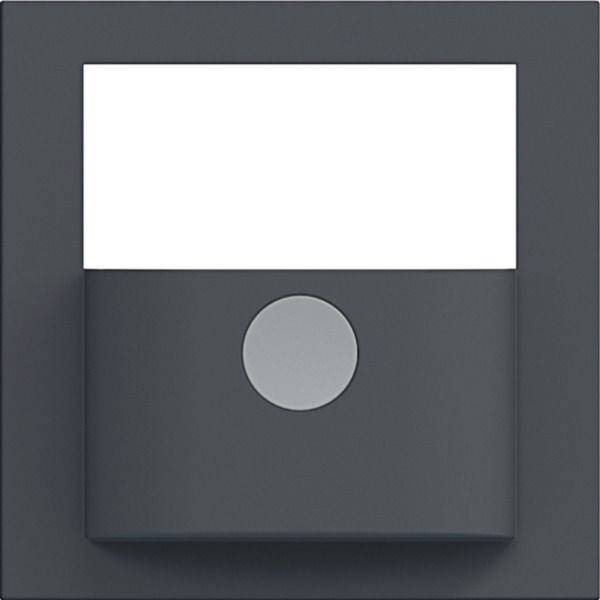 Minimalistisches dunkelgraues quadratisches Gerät mit weißem Oberpanel und einer zentrierten hellgrauen kreisförmigen Taste oder einem Sensor.