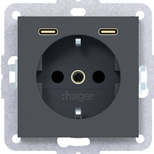Schwarze Hager Elektrosteckdose mit rundem europäischem Steckplatz auf einer Montageplatte.
