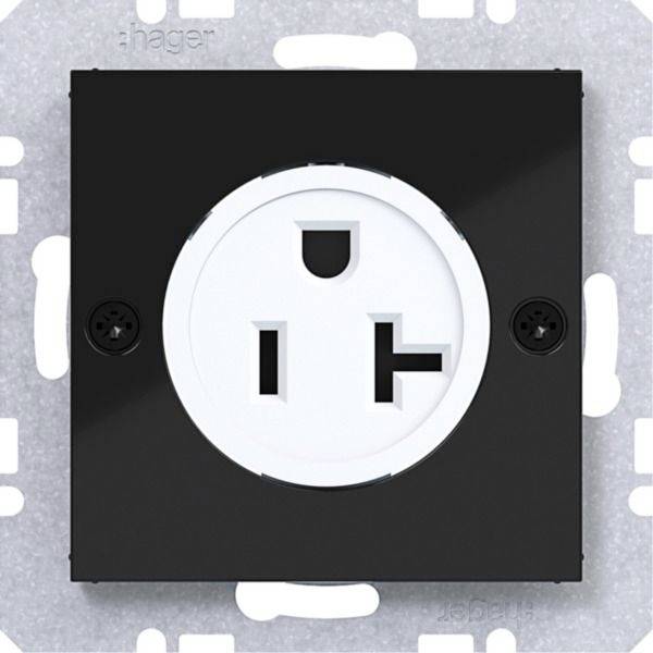 Eine einzelne elektrische Wandsteckdose mit schwarzem Blende und weißem Steckplatz, montiert auf einer Metallwandplatte.