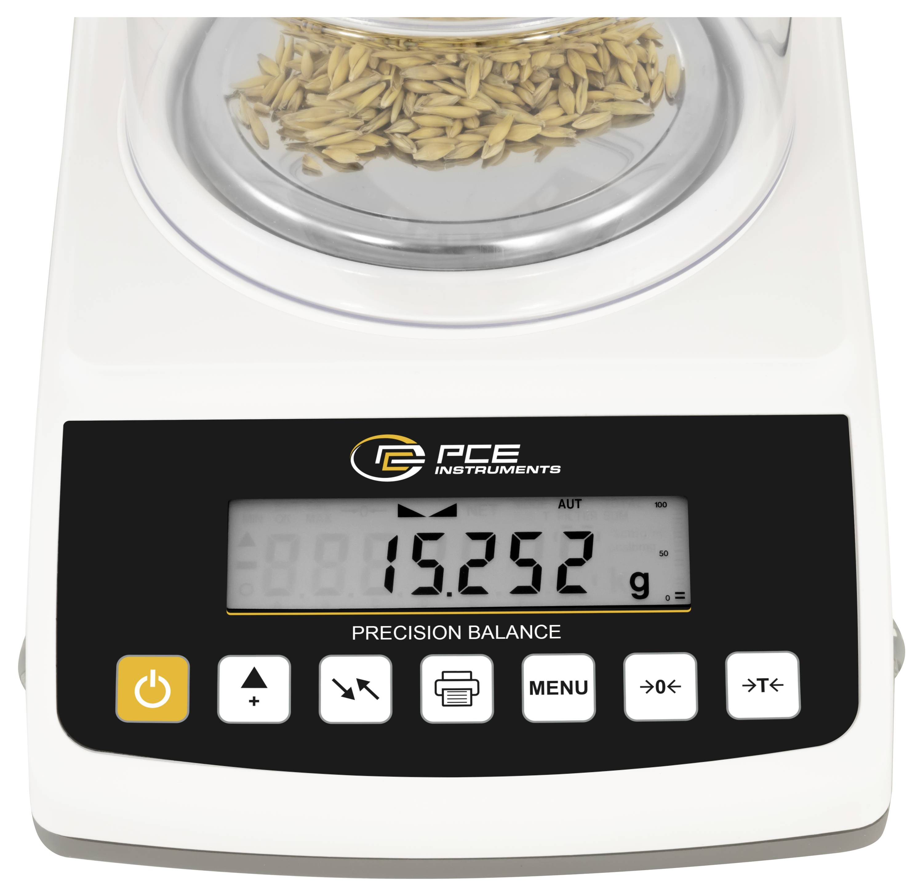 Präzisionswaage mit Getreideprobe auf der Wiegeplattform, digitales Display zeigt 15,252 g an und Bedientasten auf der Frontplatte.