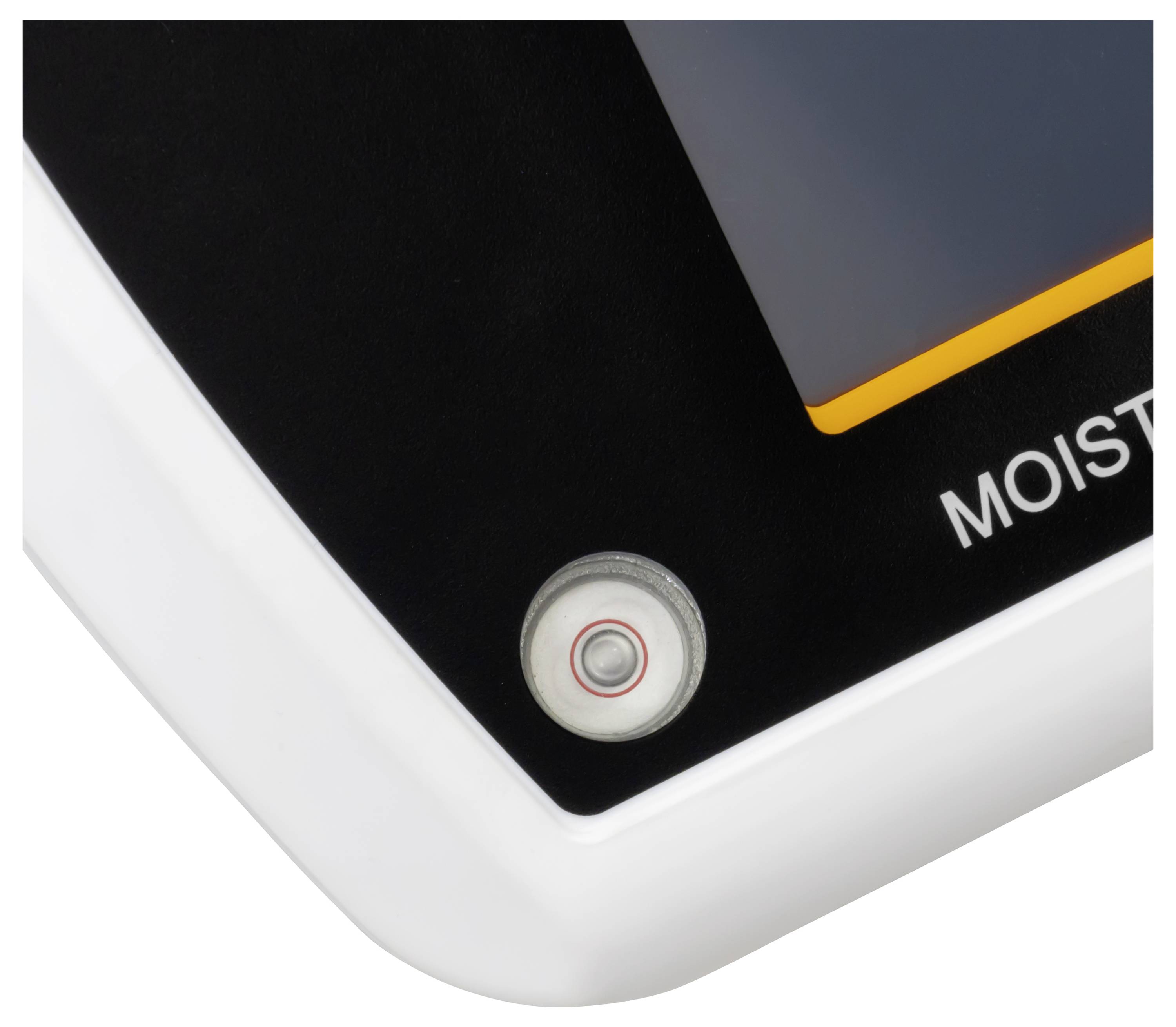 Nahaufnahme einer Gerätecke mit einem kreisförmigen Knopf oder Sensor und dem teilweise sichtbaren Etikett „MOIST