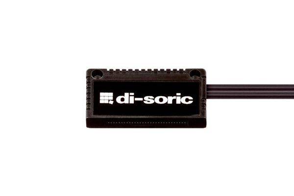 Schwarzes elektronisches Di-Soric-Sensormodul mit Logo auf weißem Hintergrund.