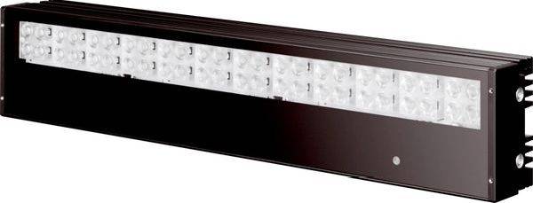 Eine lange rechteckige schwarze wandmontierte Leuchte mit einer Reihe klarer LED-Linsen über der oberen Vorderseite.