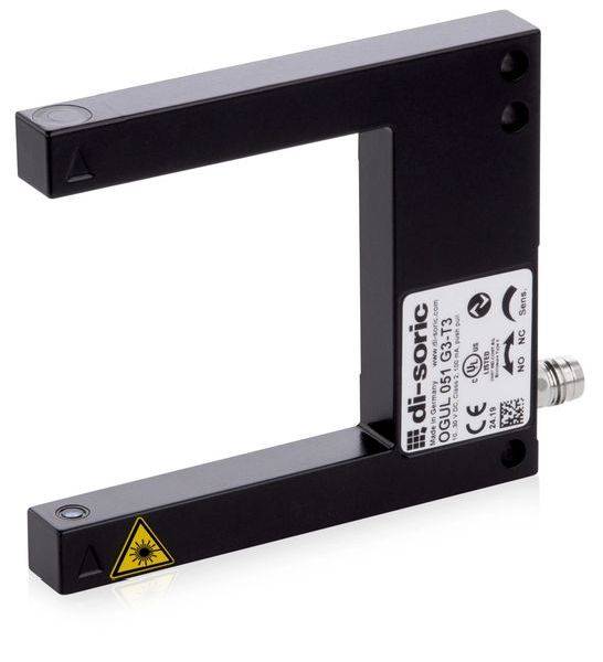Schwarzer U-förmiger Industrie-Sensor mit weißem Etikett und gelbem Laserwarnsymbol auf einem Arm.