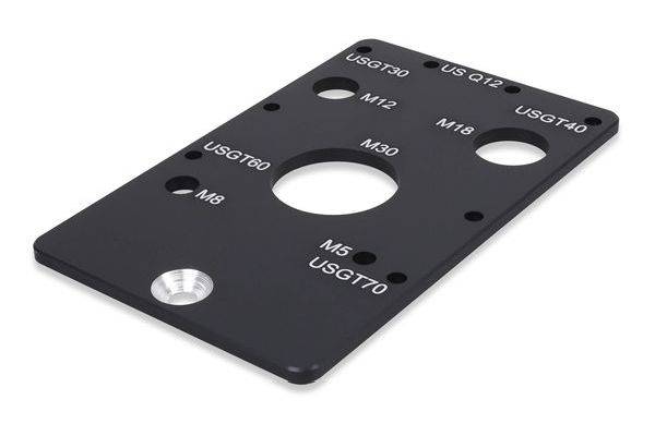 Schwarzmetall-Gewinde-Einsatzlehre mit beschrifteten Bohrungen für die Größen USG T30, US Q12, USGT40, M12, M18, M30, M8, M5 und USGT70.