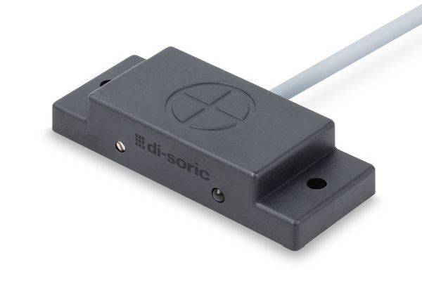 Schwarzes rechteckiges Sensor- oder Schaltermodul mit angeschlossenem Kabel und Befestigungslöchern auf weißem Hintergrund.