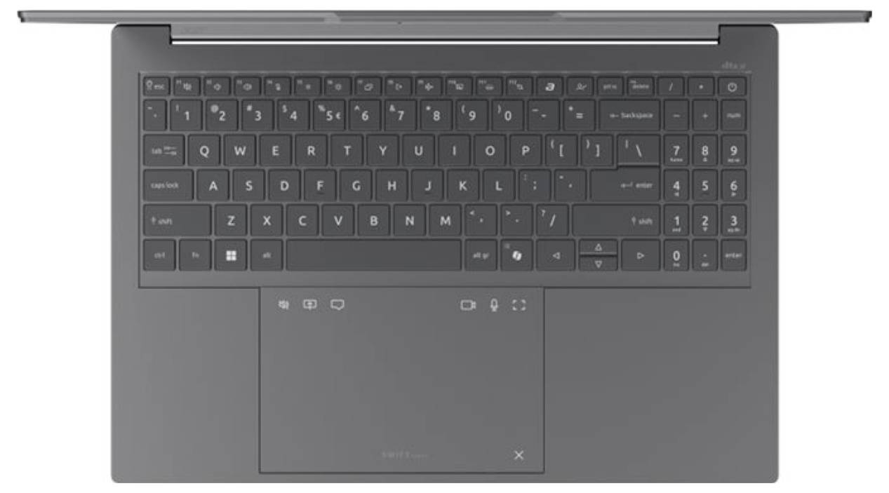 Draufsicht eines grauen Laptops, der die Tastatur und ein großes Touchpad auf einem einfachen Hintergrund zeigt.