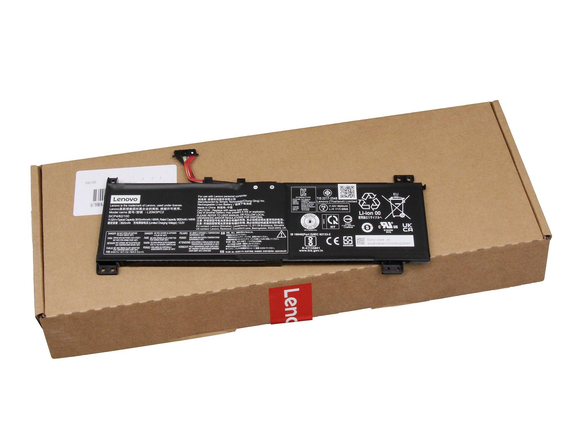 Lenovo-Laptop-Akku auf einer Kartonversandbox vor weißem Hintergrund.