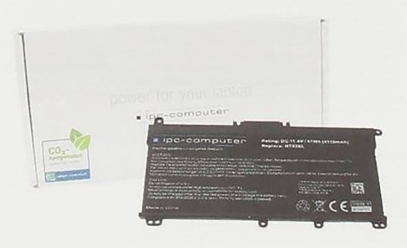Laptop-Akku neben seiner Verpackungsbox und einem kleinen grünen "umweltfreundlich"-Label