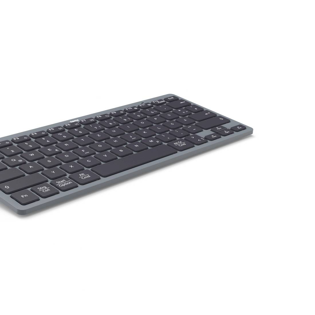 Schlanke dunkelgraue kabellose Tastatur in schräger Ansicht auf einfachem weißem Hintergrund.