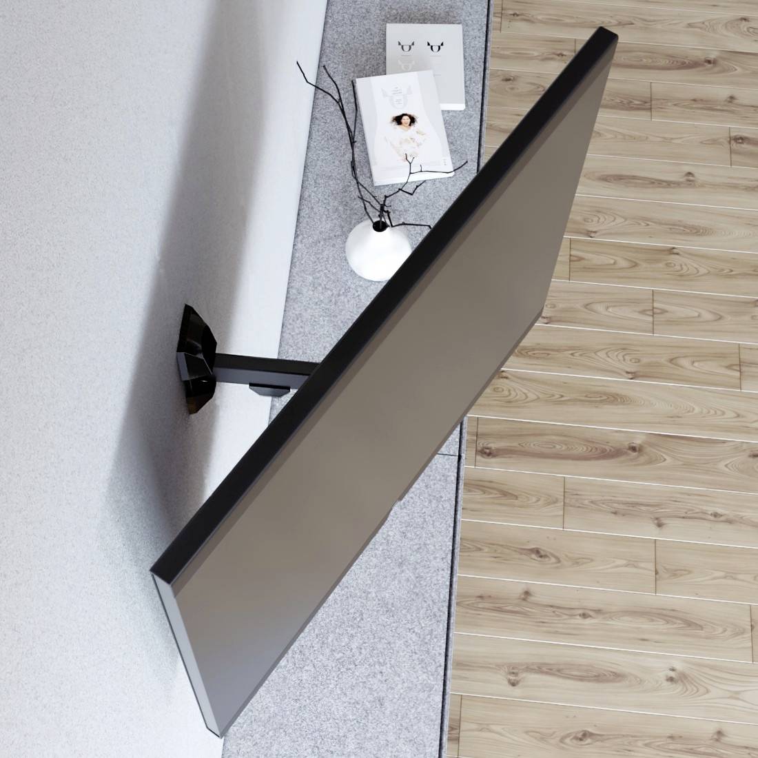 An der Wand montierter Flachbildfernseher von der Seite in einem modernen Zimmer betrachtet, mit einem kleinen Dekorationstisch und Zeitschriften auf einem Teppich neben einem Holzfußboden.