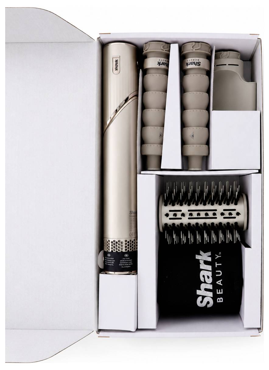 Offene Geschenkbox mit einem Shark Beauty Haarstyling-Set mit Stabaufsätzen, einer Rundbürste und einem schwarzen 