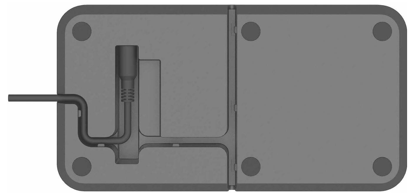 Querschnittsdiagramm eines rechteckigen mechanischen Gehäuses mit einem L-förmigen Rohr auf der linken Seite, das in eine interne vertikale Kammer und einen zentralen Teiler führt.