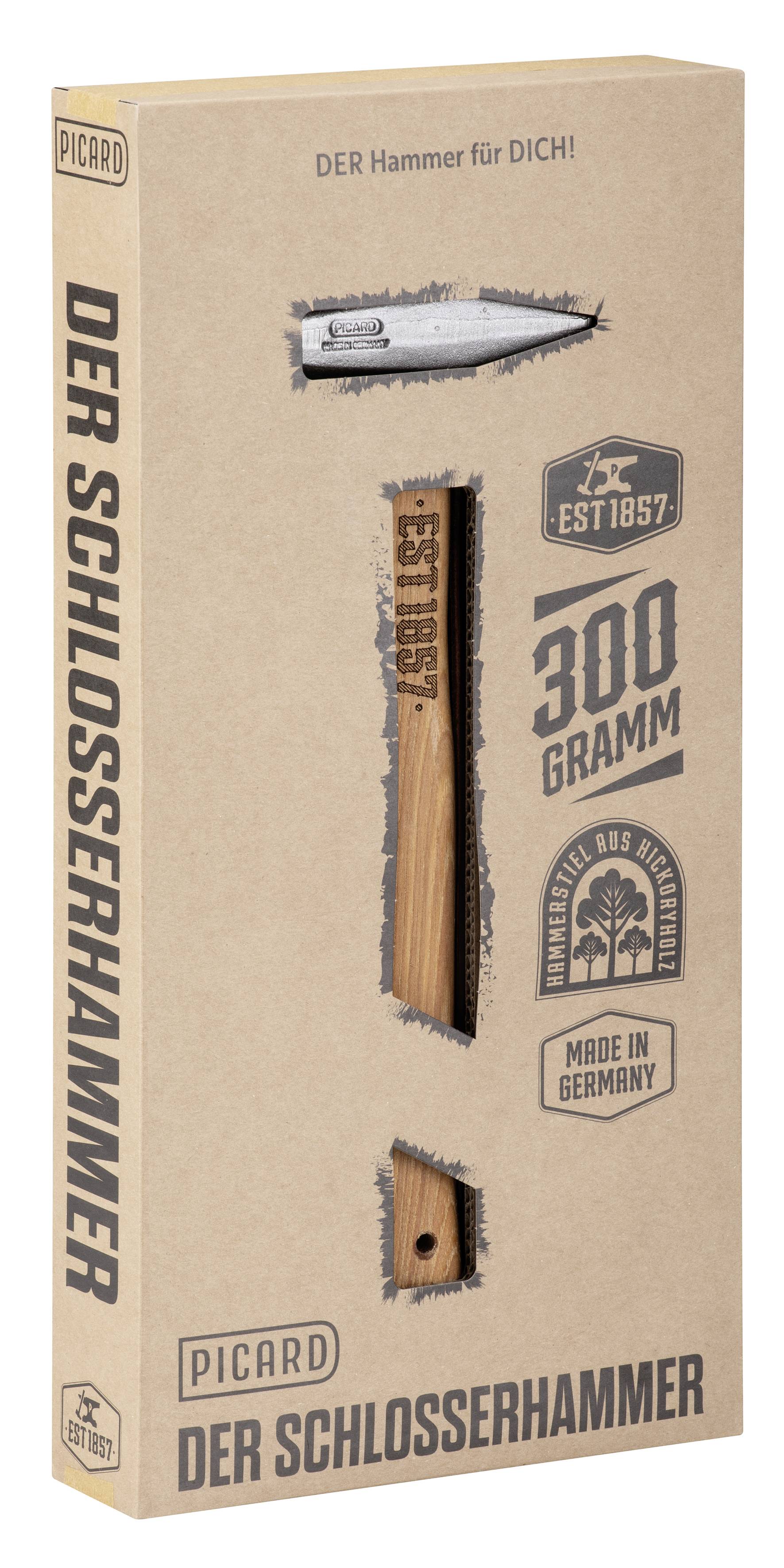Verpackungsbox für Picard 'Der Schlosserhammer' mit einer Hammerillustration und dem Text '300 Gramm' und 'Made in Germany'.