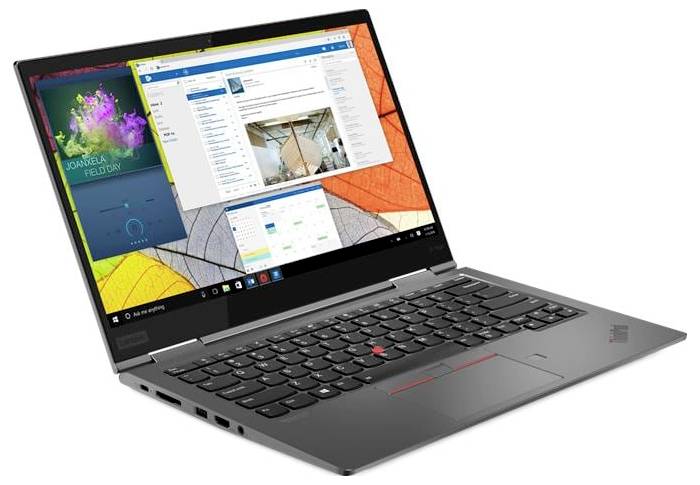 Silberner Lenovo-Laptop in einem Winkel geöffnet, zeigt einen Windows-Desktop mit mehreren App-Fenstern auf dem Bildschirm.
