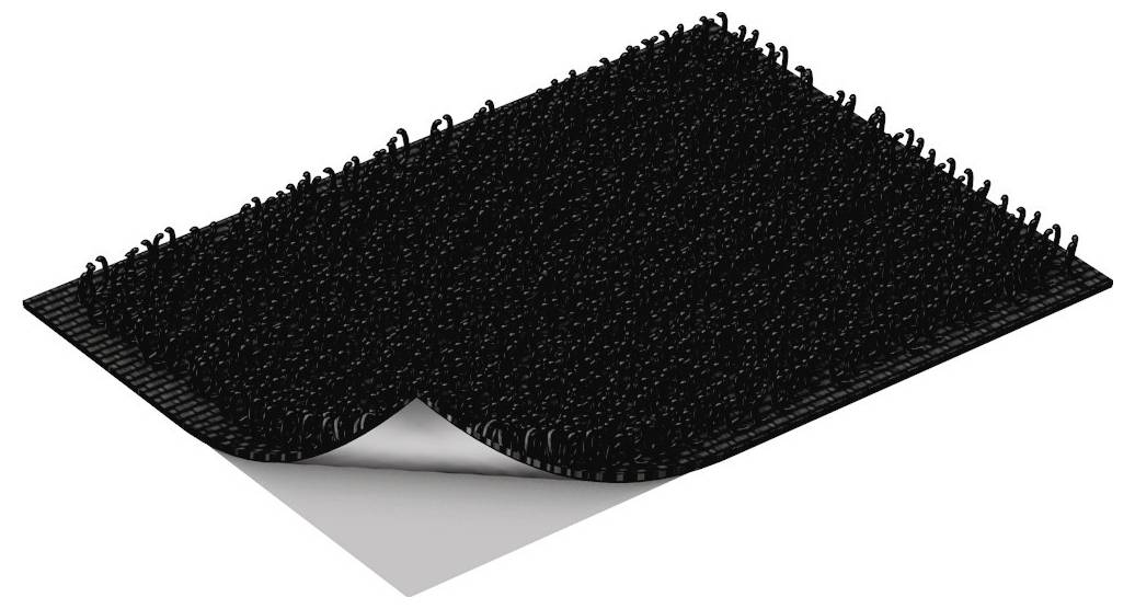 Schwarze strukturierte Bodenmatte mit einer gekrümmten Ecke, die eine hellgraue Unterseite enthüllt