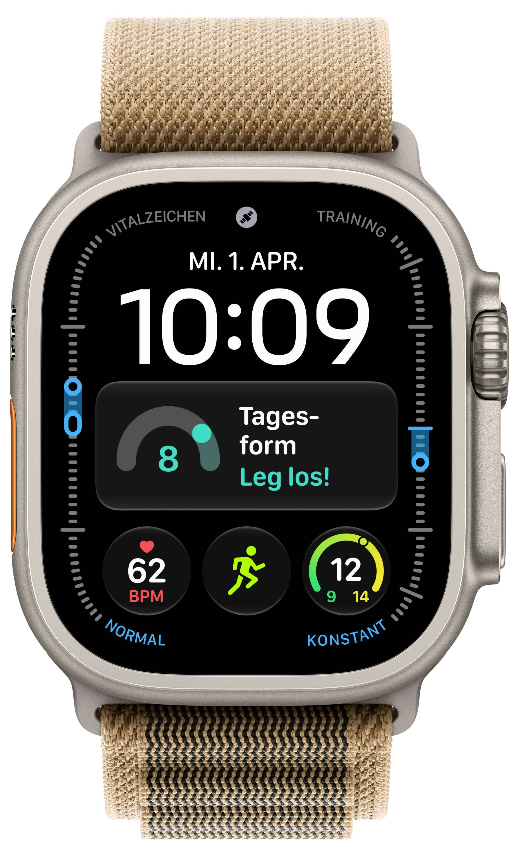 Apple Watch zeigt 10:09 an, Montag, 1. April, mit einer Trainings-/Tagesaktivitäts-Komplikation, Herzfrequenz 62 BPM und Aktivitätsringen auf einem beigen Stoffarmband.