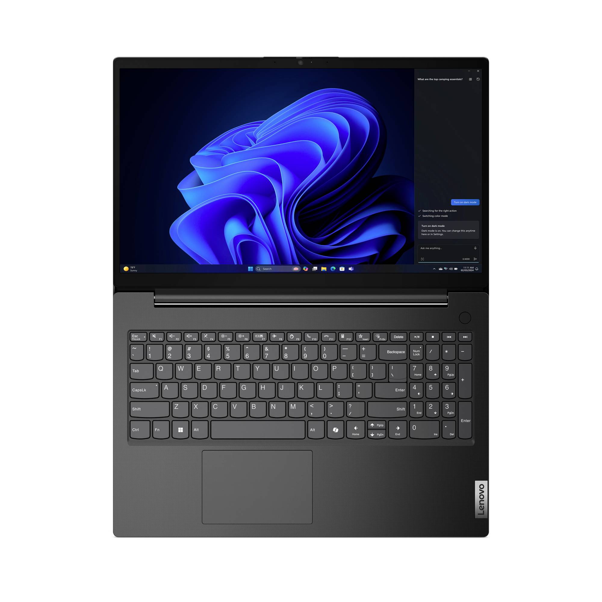 Draufsicht auf einen Lenovo-Laptop mit geöffnetem Windows 11, zeigt die Tastatur, das Touchpad und den Bildschirm mit einem blauen abstrakten Hintergrundbild.