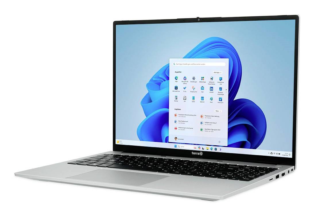 Silberner Laptop, auf dem der Windows 11-Desktop mit geöffnetem Startmenü auf einem blauen abstrakten Hintergrundbild angezeigt wird.