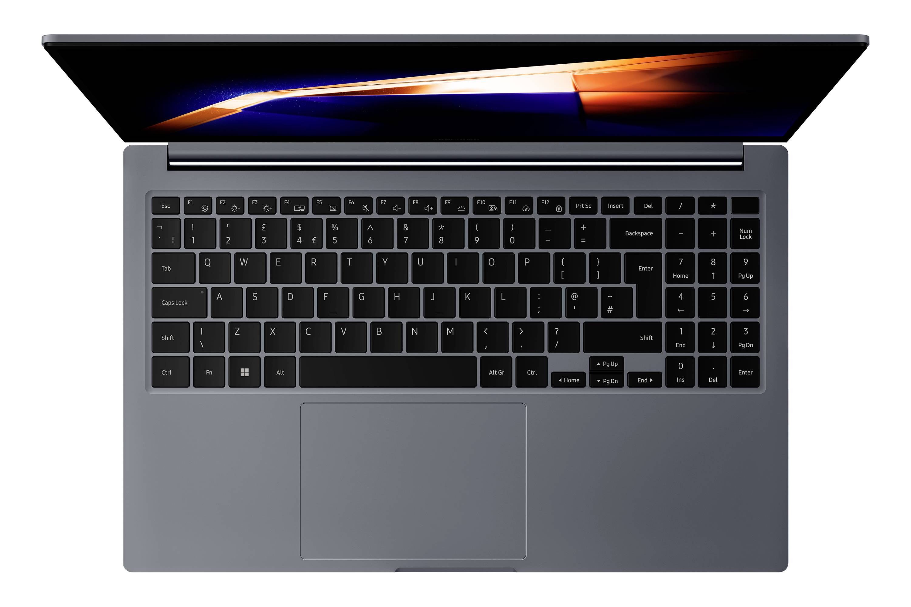 Draufsicht auf einen offenen grauen Laptop mit schwarzer Tastatur und großem Trackpad auf weißem Hintergrund.
