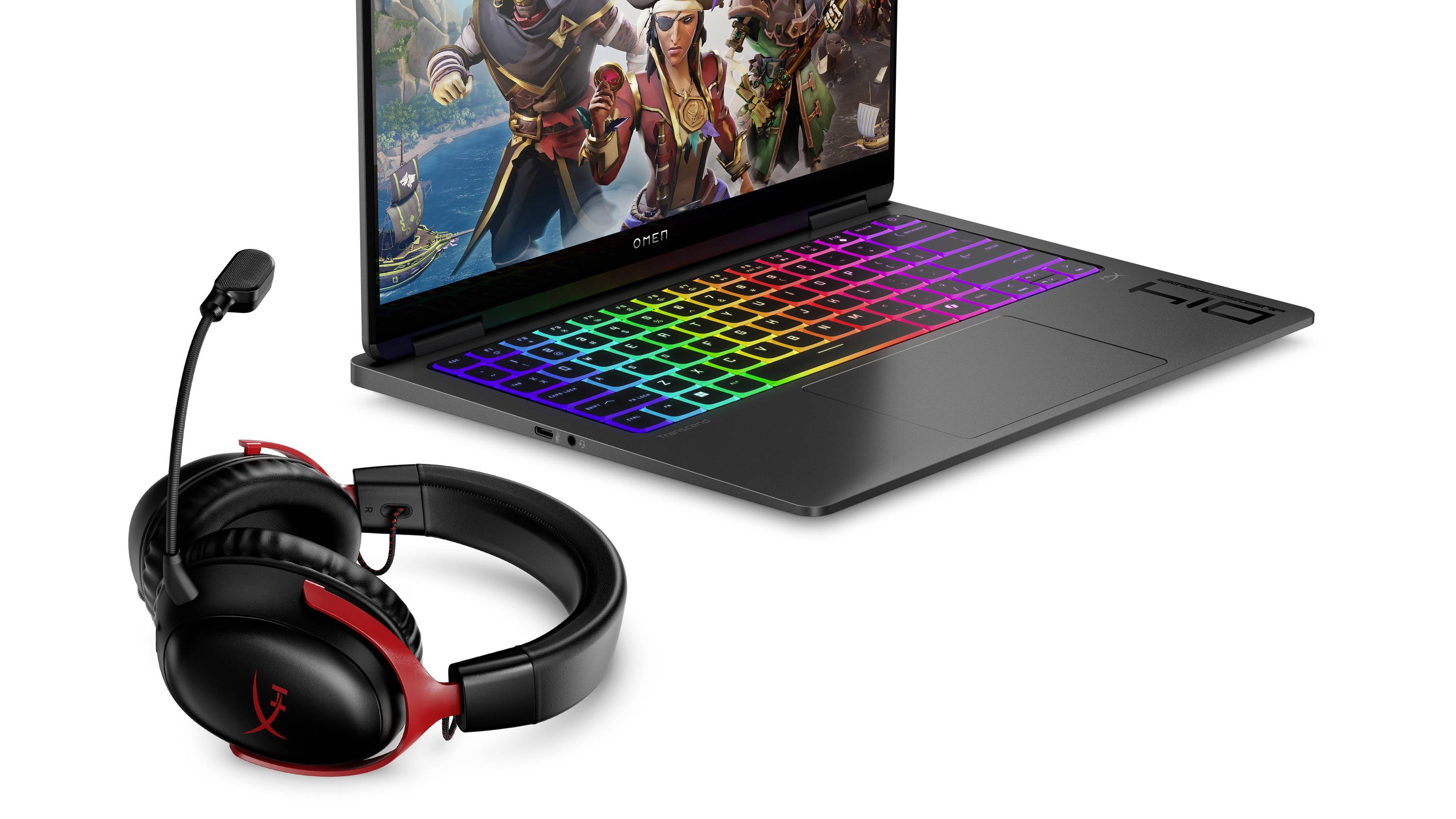 Gaming-Laptop mit regenbogenfarbig beleuchteter Tastatur neben schwarzem und rotem Over-Ear-Gaming-Headset mit Mikrofon auf weißem Hintergrund.