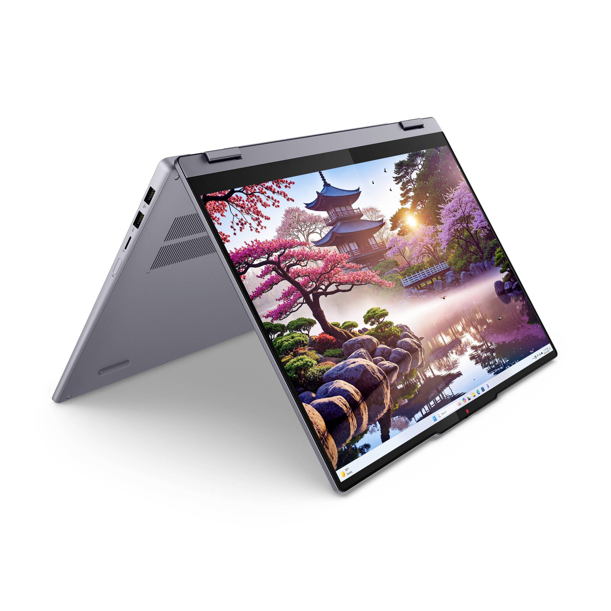 2-in-1-Laptop im Zeltmodus zeigt ein lebendiges Landschafts-Hintergrundbild mit einer Pagode, Kirschblüten, Steinen und Wasserreflektion.