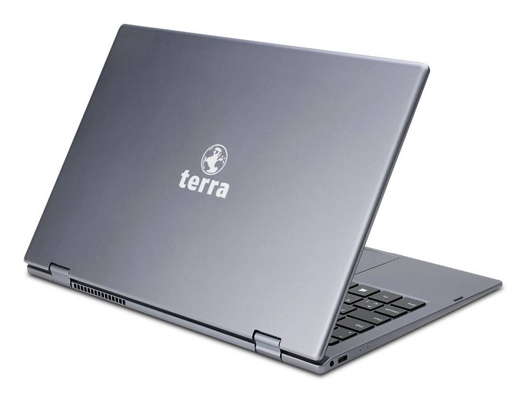 Geschlossener grauer Terra-Laptop in schräger Ansicht auf weißem Hintergrund, wobei ein Teil der Tastatur sichtbar ist.