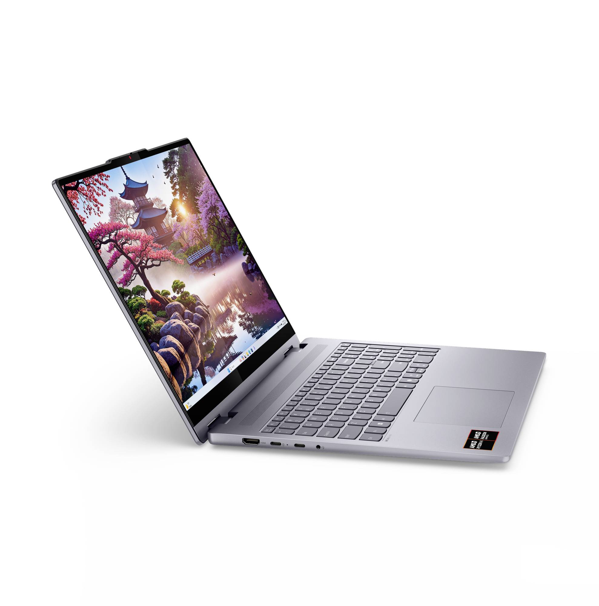 Silberner Laptop in einem Winkel geöffnet, zeigt ein farbenfrohen landschaftlichen Hintergrund mit einem Tempel, Kirschblüten und einem sonnenbeschienenen See.