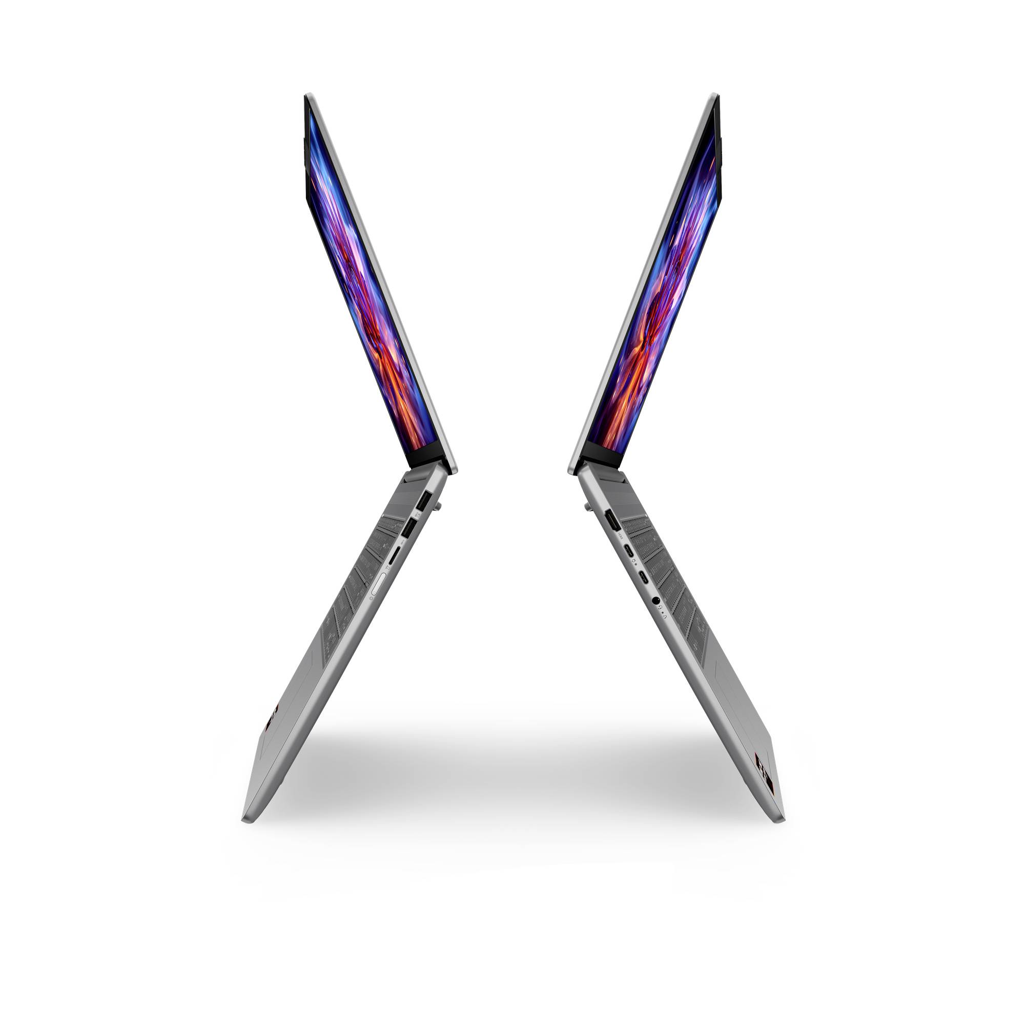 Zwei schlanke Laptops in X-Form geöffnet, von der Seite auf weißem Hintergrund gezeigt, wobei ihre dünnen Profile und farbenfrohen Bildschirme hervorgehoben werden.