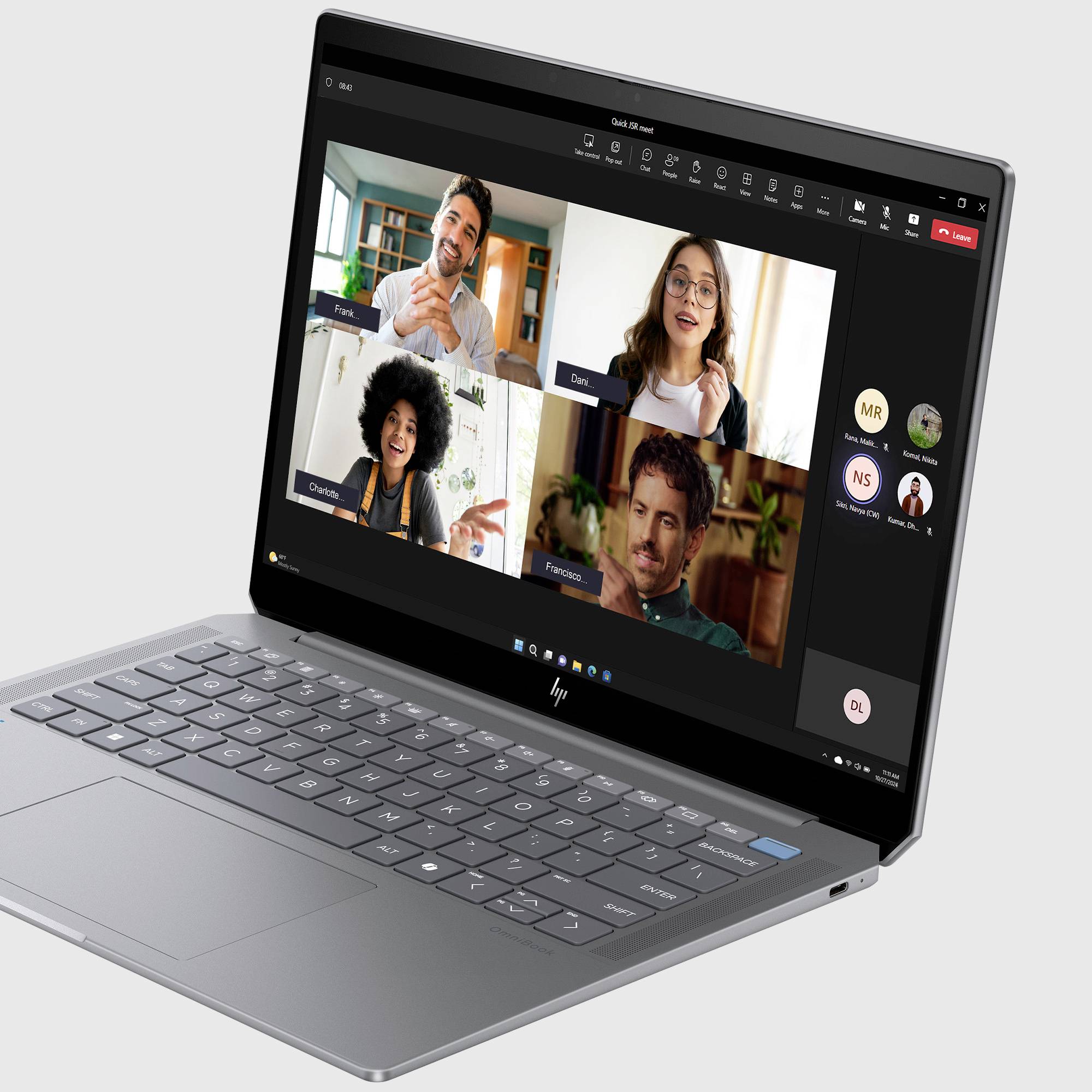 Ein Laptop zeigt eine Videokonferenz mit vier Personen in einem Rasterformat, mit Teilnehmer-Avataren an der Seite und Meeting-Steuerungen oben.