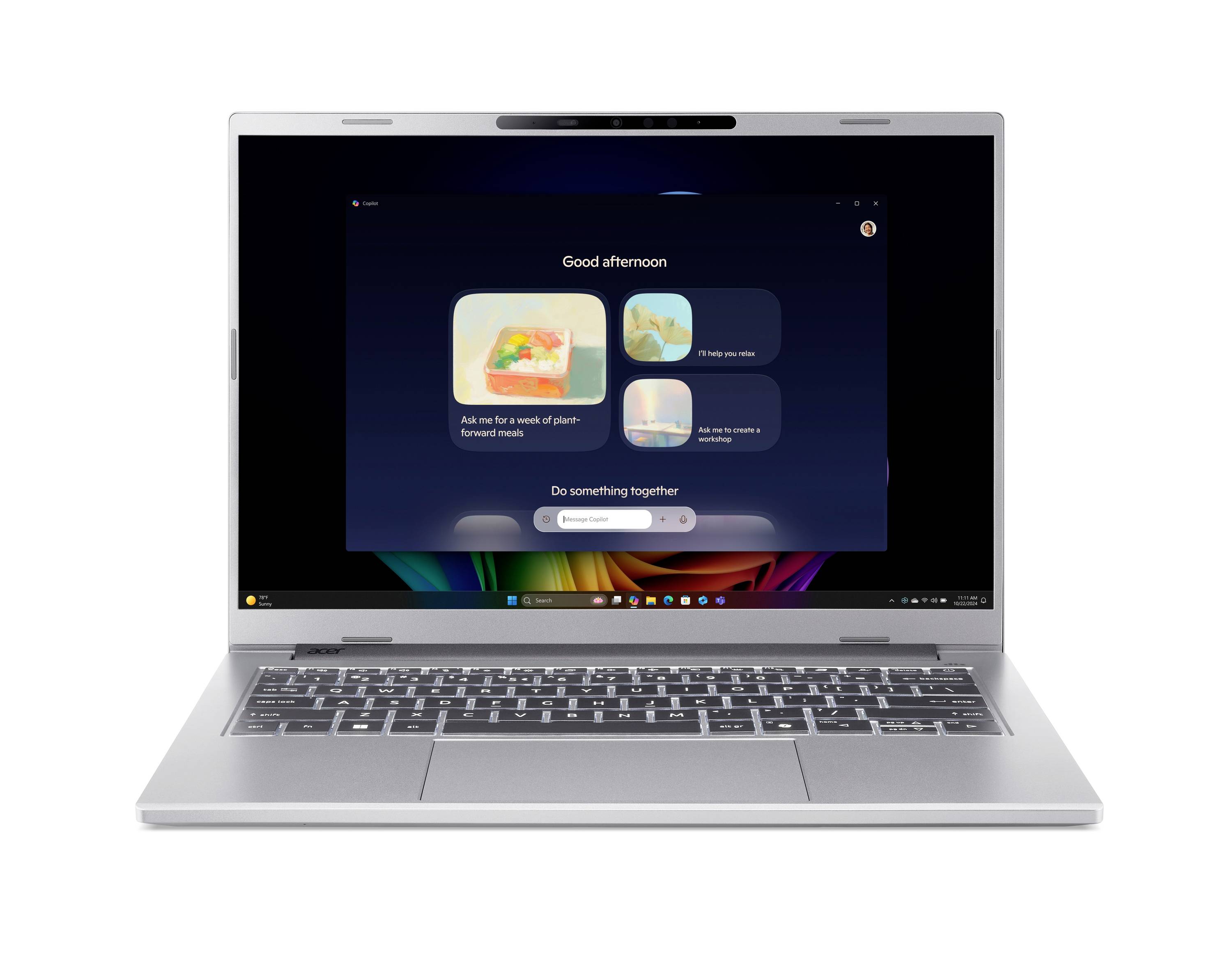Silberner Laptop mit dunklem Willkommensbildschirm, auf dem 