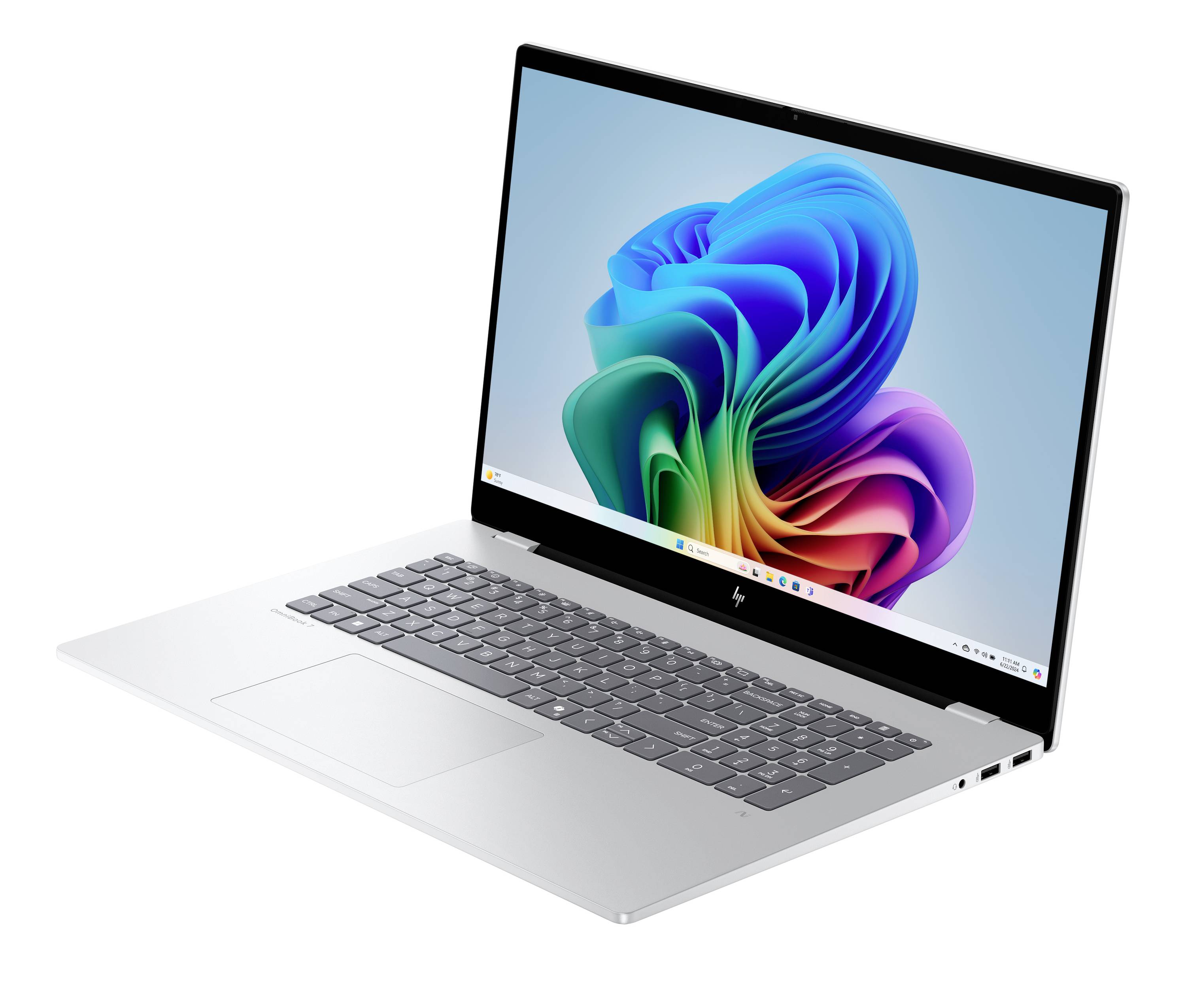 Ein silberner Laptop, der in einem Winkel geöffnet ist und einen farbenfrohen abstrakten Hintergrund auf dem Bildschirm zeigt.