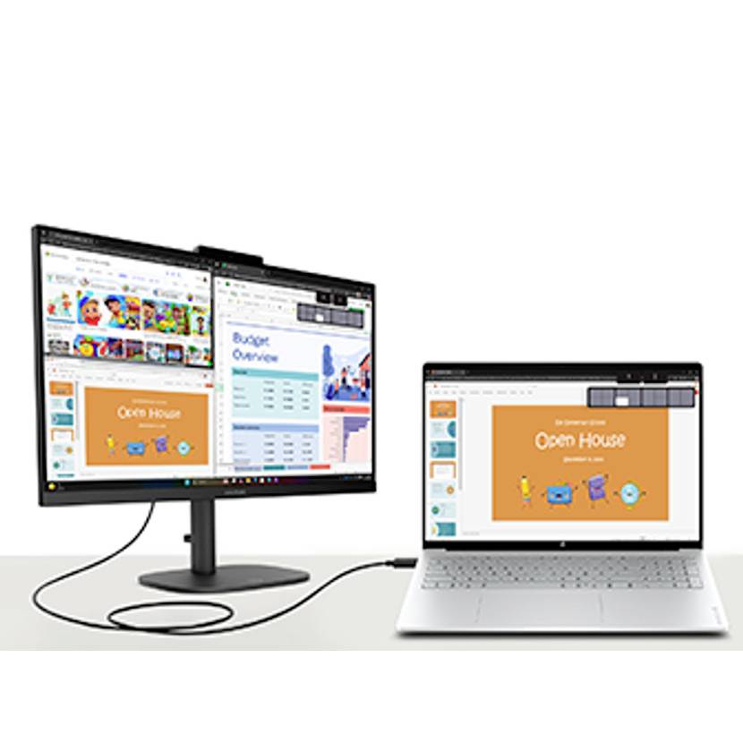 Laptop verbunden mit einem externen Monitor, beide zeigen Präsentationsfolien und Office-Arbeitsfenster mit einer sichtbaren "Open House"-Folie an.