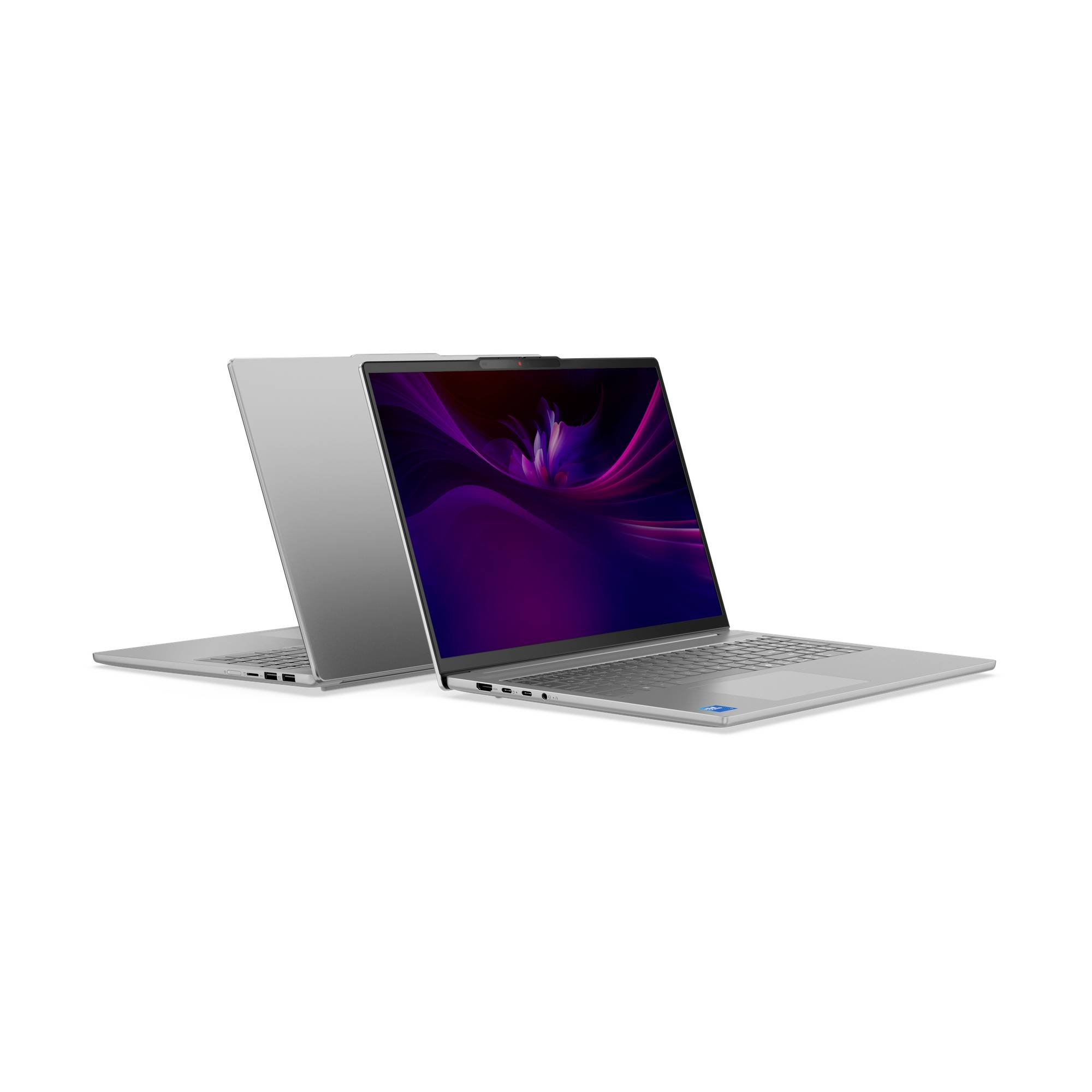 Zwei silberne Laptops, einer offen mit violettem abstrakten Bildschirm und einer geschlossen, auf weißem Hintergrund angezeigt.
