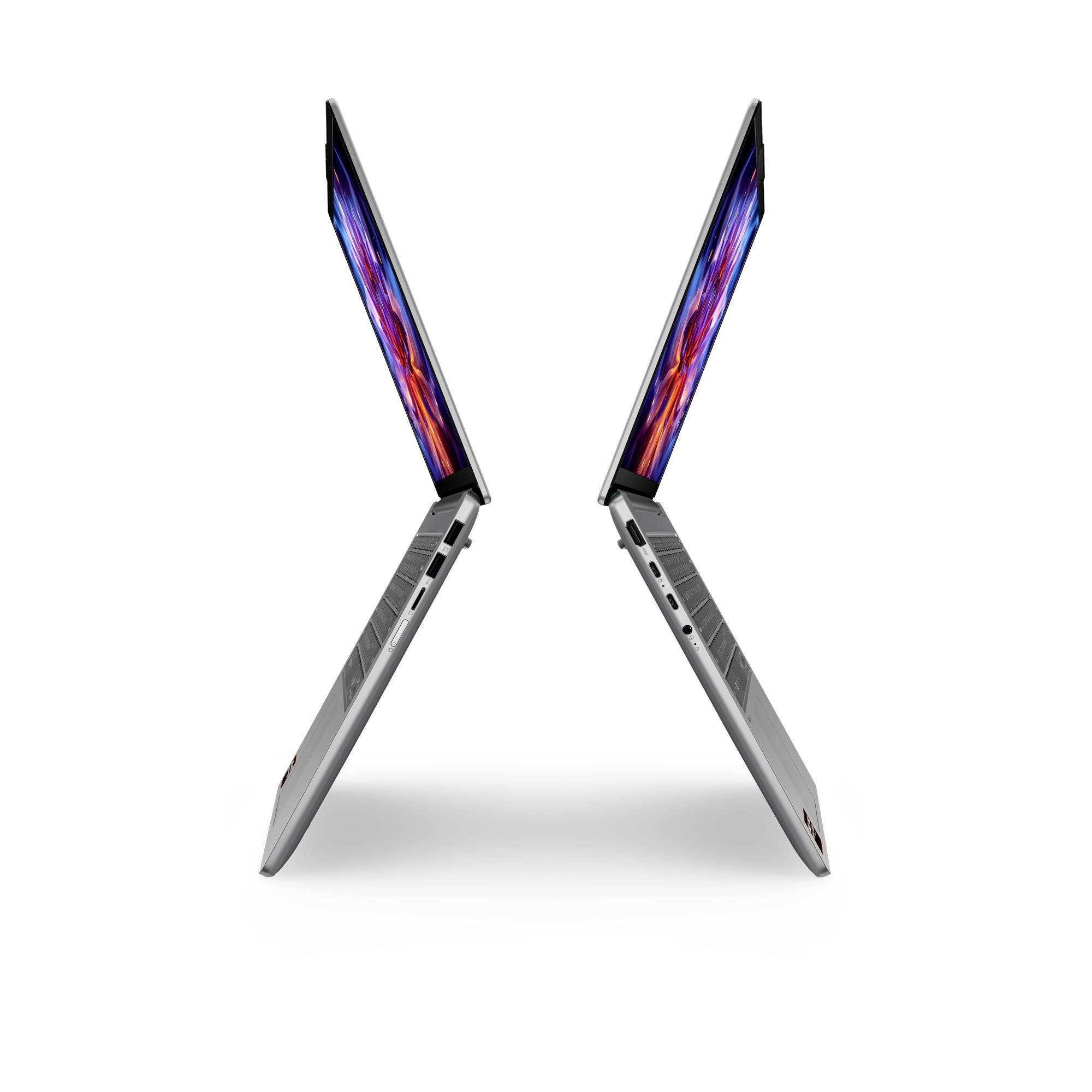 Zwei dünne Laptops werden nebeneinander in einer X-Form geöffnet angezeigt und zeigen farbenfrohe Bildschirme vor einem weißen Hintergrund.