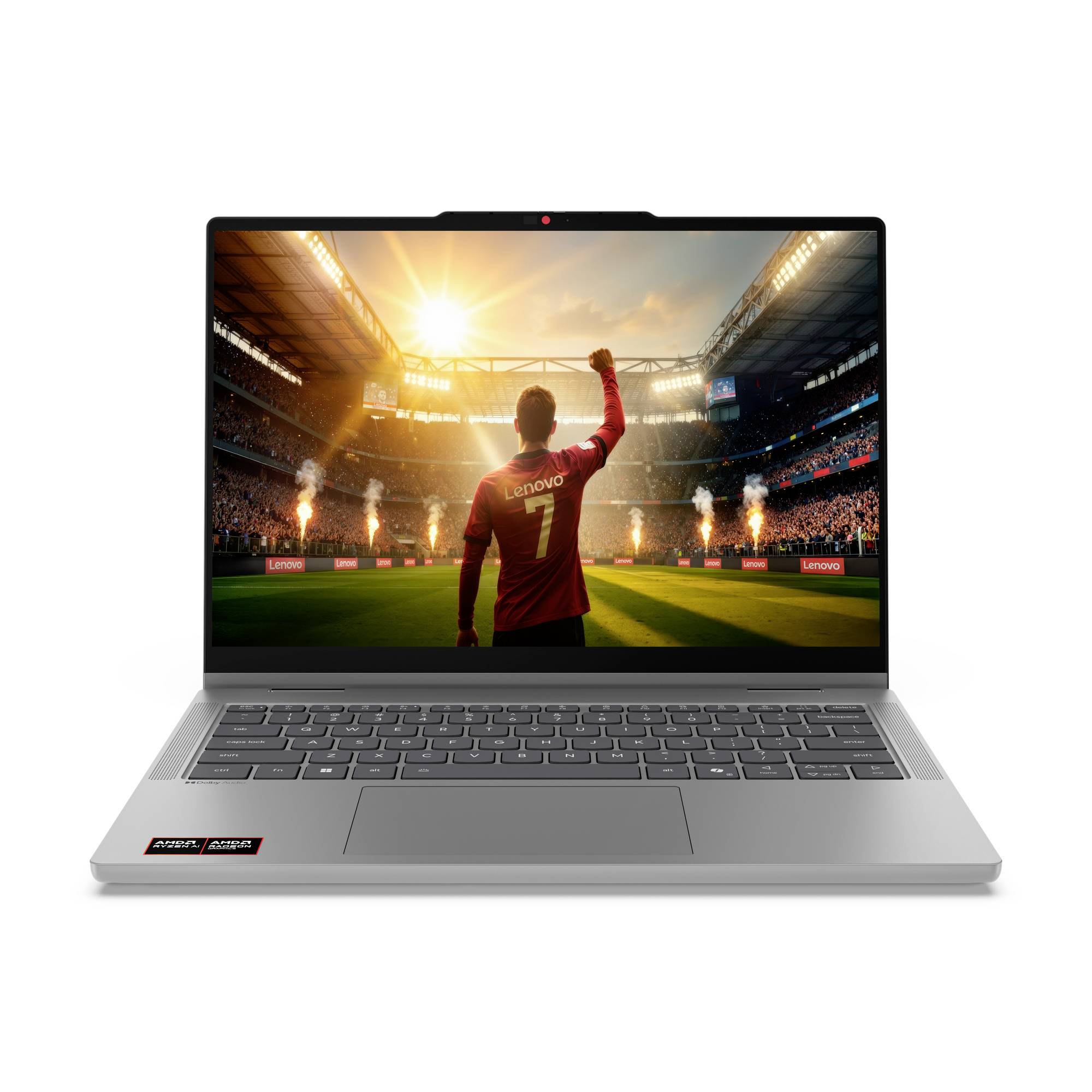 Silberner Laptop, auf dem ein Fußballspieler in einem roten Trikot mit erhobener Faust in einem Stadion bei Sonnenuntergang zu sehen ist.
