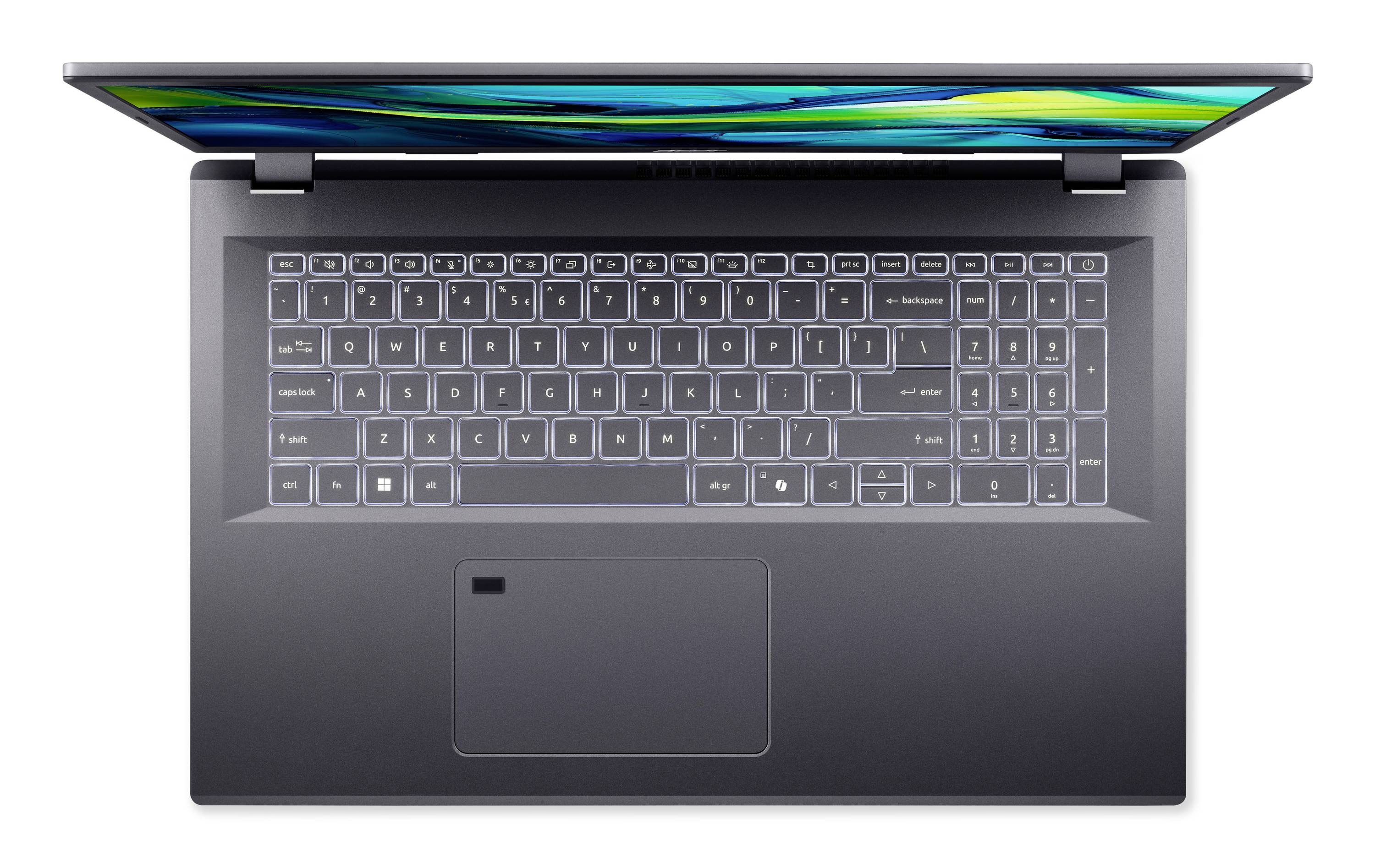 Draufsicht auf einen offenen grauen Laptop mit Tastatur, Touchpad und hellem Display, das abstrakte grüne und blaue Lichtstreifen zeigt.