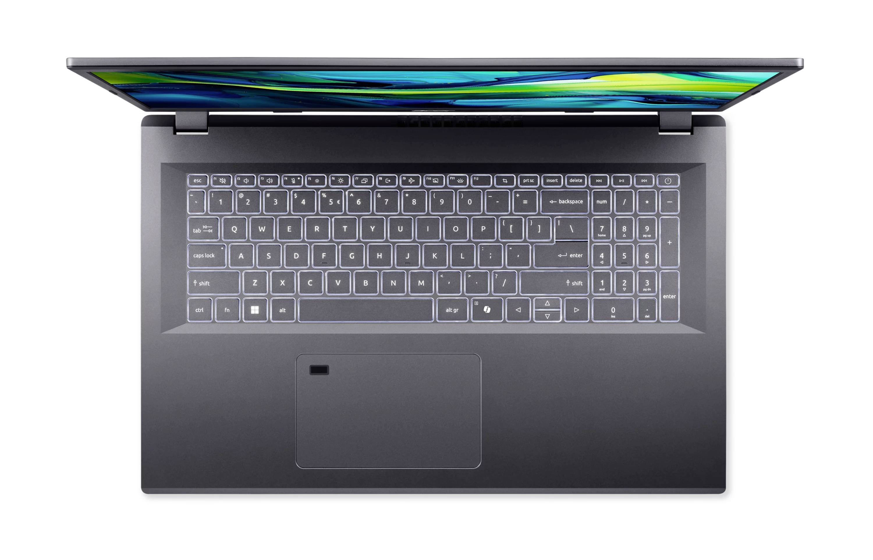 Laptop von oben betrachtet, zeigt Tastatur und großes Touchpad auf weißem Hintergrund.