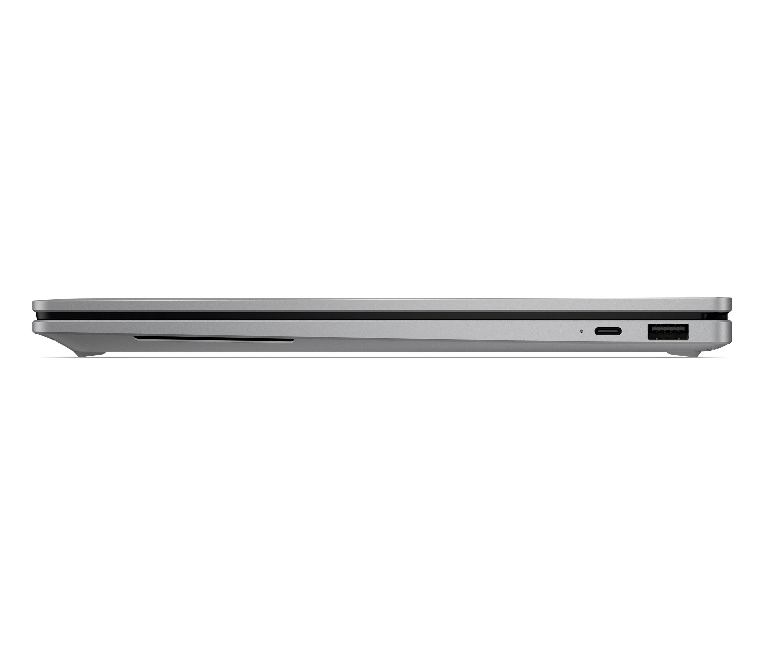 Seitenansicht eines schlanken silbernen Laptops im geschlossenen Zustand, die die Kante mit Anschlüssen auf weißem Hintergrund zeigt.