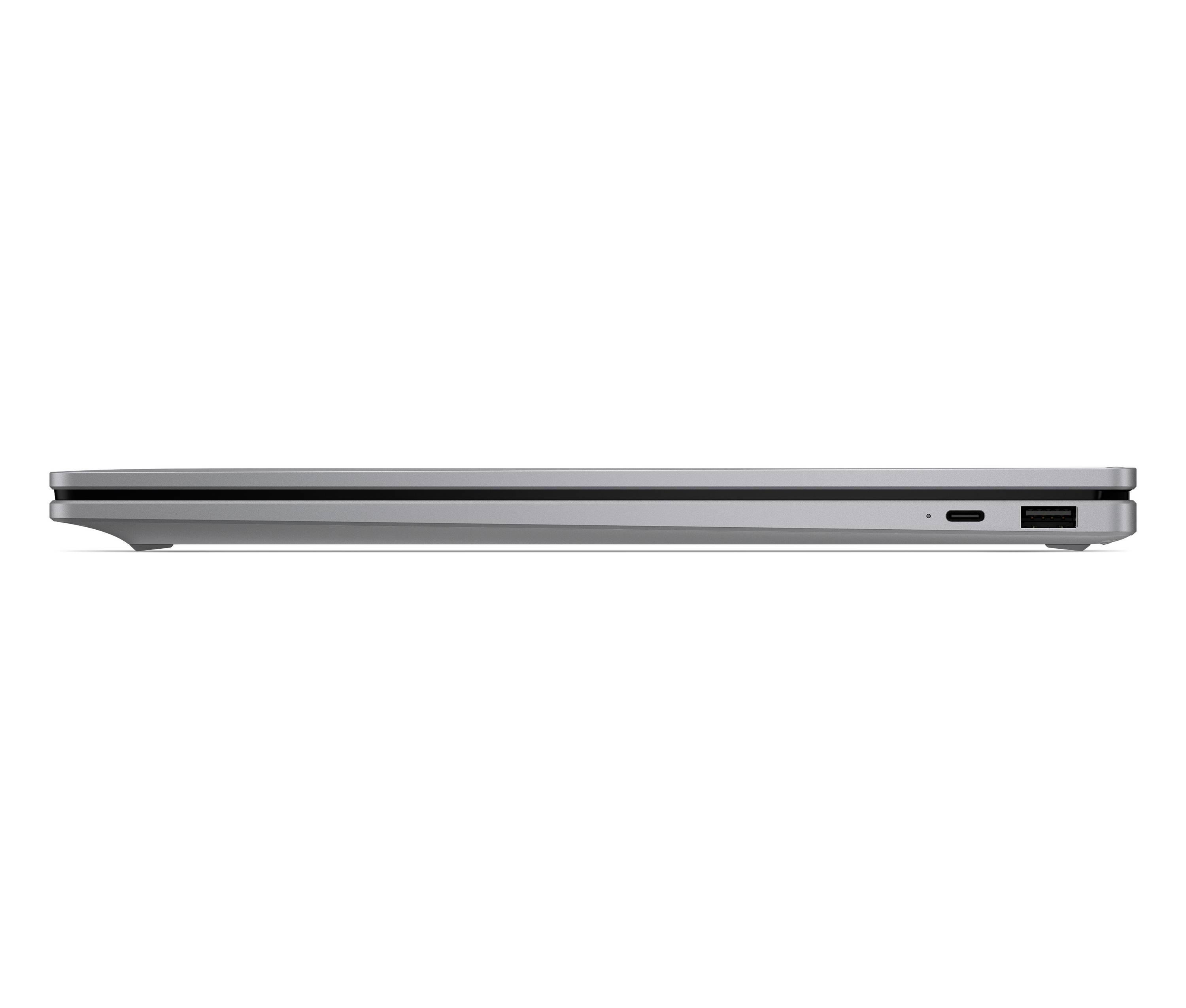 Seitenansicht eines schlanken silbernen Laptops, geschlossen, mit zwei USB-Anschlüssen auf der rechten Seite.