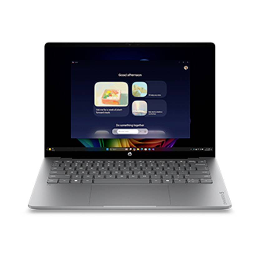 Silberner Laptop mit dunklem Willkommensbildschirm, auf dem "Guten Nachmittag" und vier App-Kacheln in der Mitte des Displays angezeigt werden.