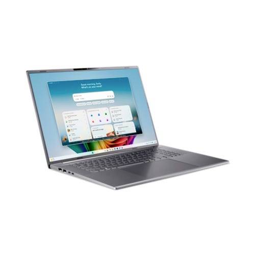 Silberner Laptop auf weißem Hintergrund geöffnet, auf dem Bildschirm ein Windows-ähnlicher Startbildschirm mit Suchleiste und App-Kacheln.