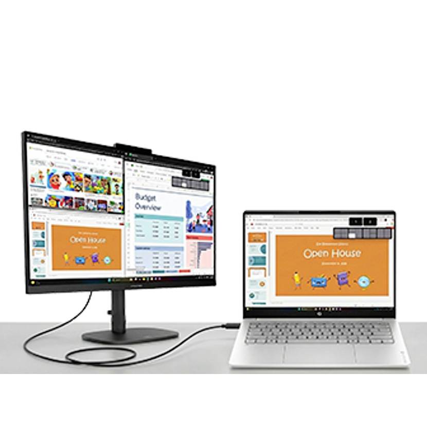 Laptop verbunden mit einem externen Monitor, auf beiden werden verschiedene Präsentations- und Dokumentfenster angezeigt, einschließlich einer "Open House"-Folie und einer Budgetübersicht.