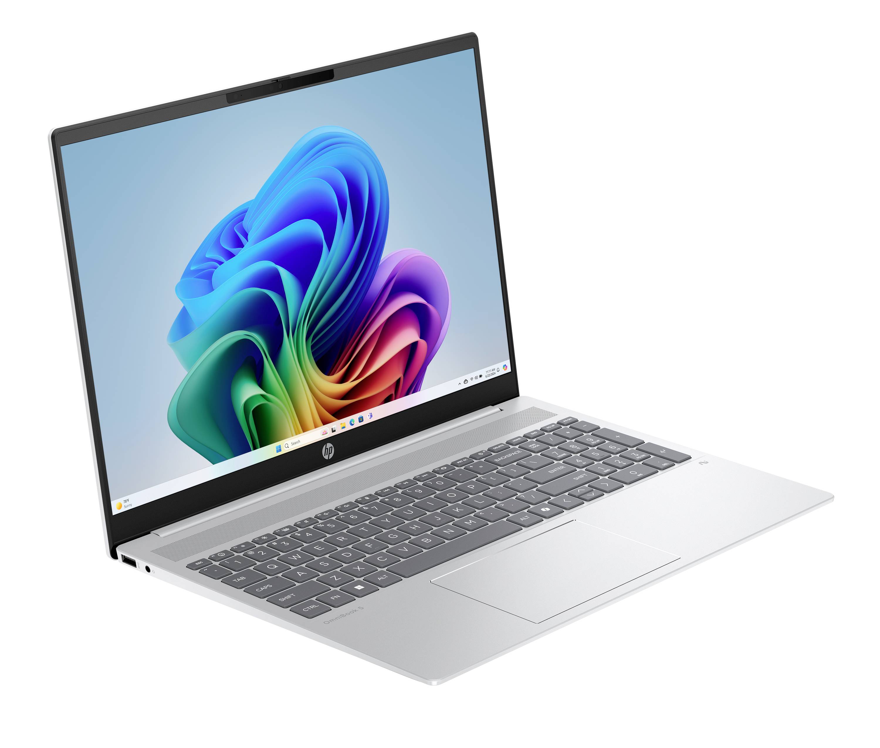 Silberner HP-Laptop im Winkel geöffnet und zeigt ein farbenfrohen abstrakten Windows-ähnlichen Hintergrund auf dem Bildschirm.